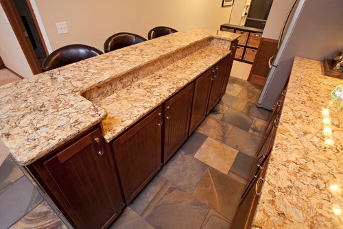 Cambria Buckingham Countertop and Raised Breakfast Bar Island Top with Brown Berry Stained Birch Cabinets and Natural Slate Flooring